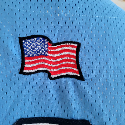 a close up of a football jersey with an american flag on it