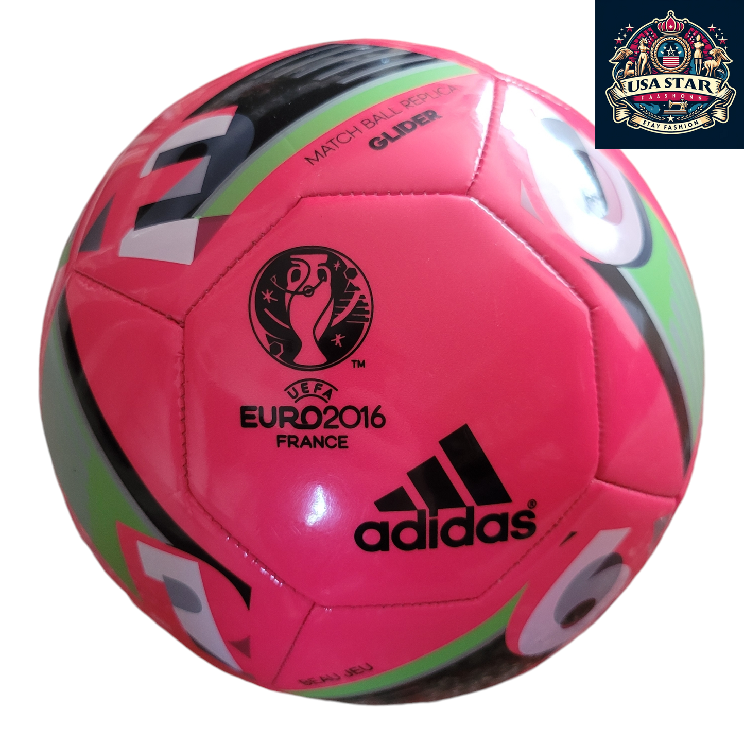 a pink soccer ball with black and green stripes