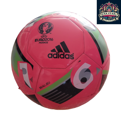 a red soccer ball with black and green stripes