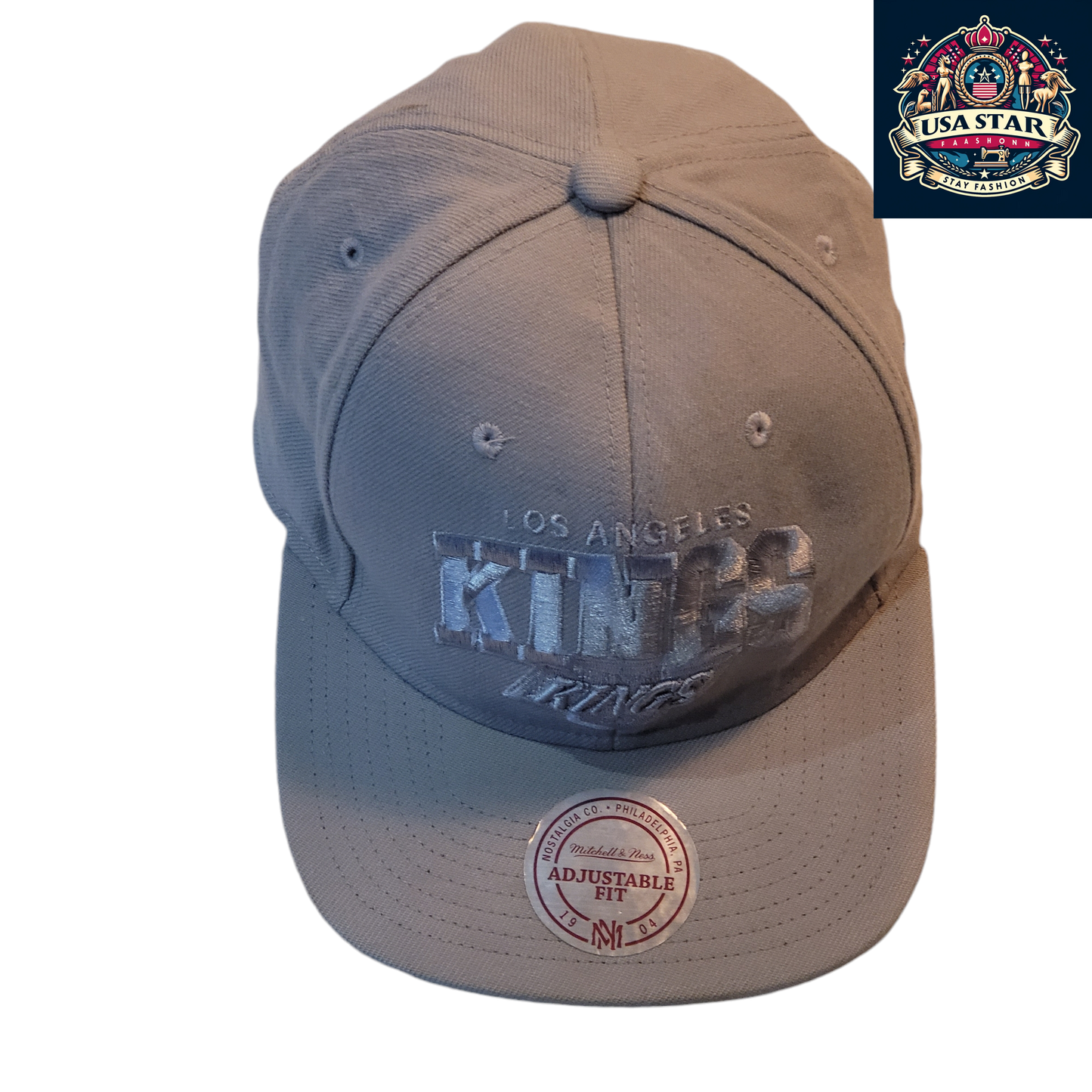 a gray hat with the word king on it