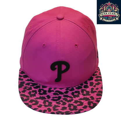 a pink hat with a black p on it