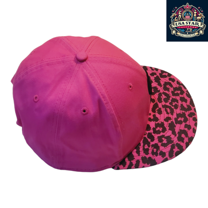 a pink hat with a leopard print on it