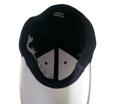 a black and white hat with a shark on it