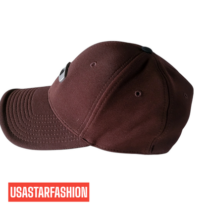 a brown hat with a black patch on the side