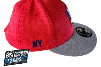 a red and grey hat with a new york yankees patch on it