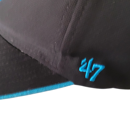 a black and blue hat with the number 47 on it