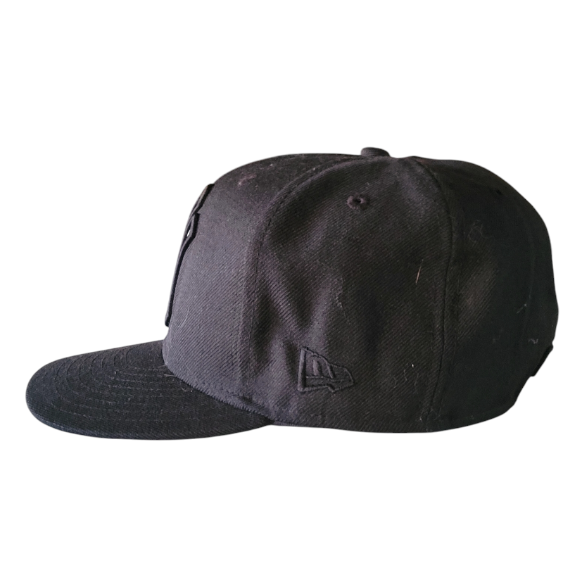 a black baseball cap with a white background