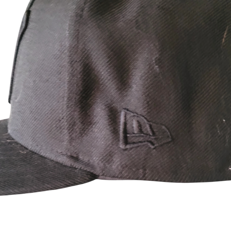 a black hat with a white logo on it