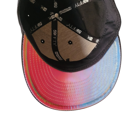 a hat with a black visor on top of it