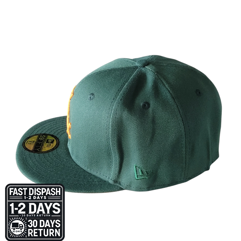 a green hat with a yellow peak on it