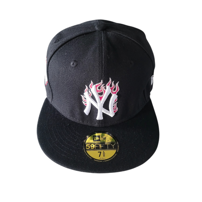 a new york yankees hat with flames on it