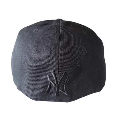 a new york yankees cap on a white background