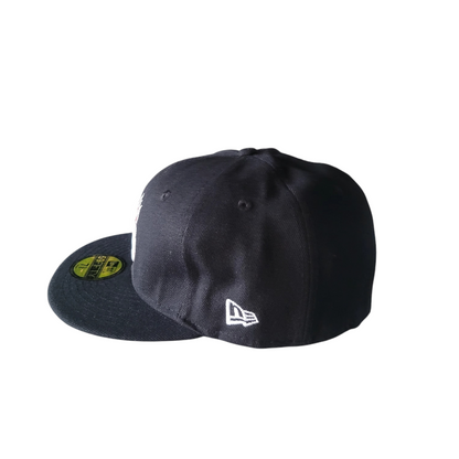 a new era hat with a black and yellow logo