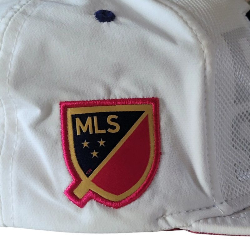 a close up of a baseball cap with a patch on it