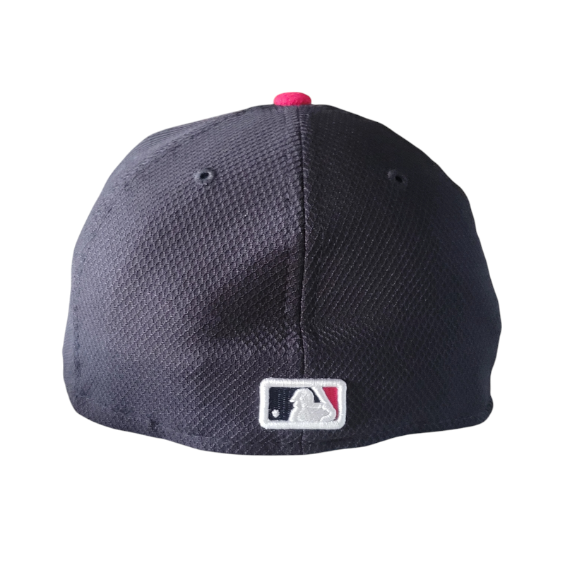 a baseball cap with a red and white patch on it