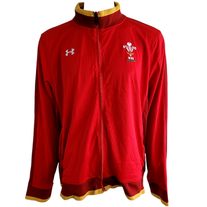 a red jacket with a gold trim and a crest on it