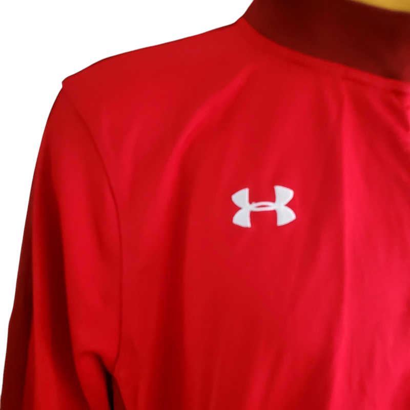 a close up of a red shirt with a white undershirt