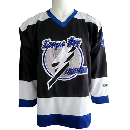 a hockey jersey with a lightning logo on it