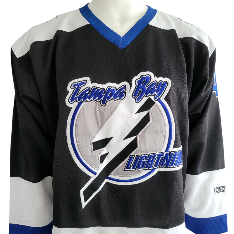 a hockey jersey with a lightning logo on it