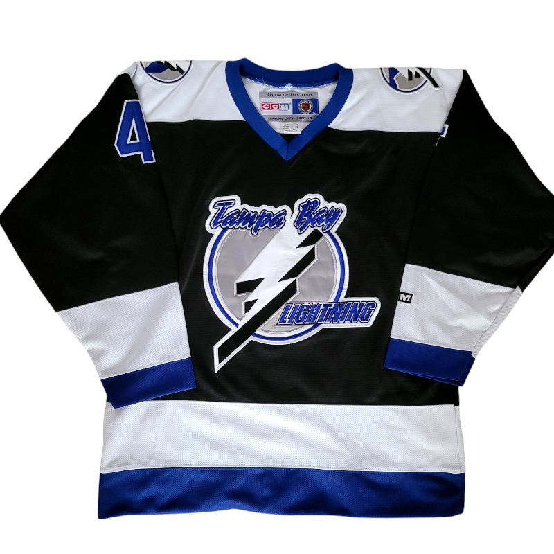 a hockey jersey with a lightning logo on it