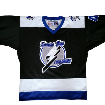 a hockey jersey with a lightning logo on it