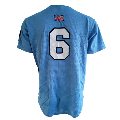 a blue jersey with the number six on it