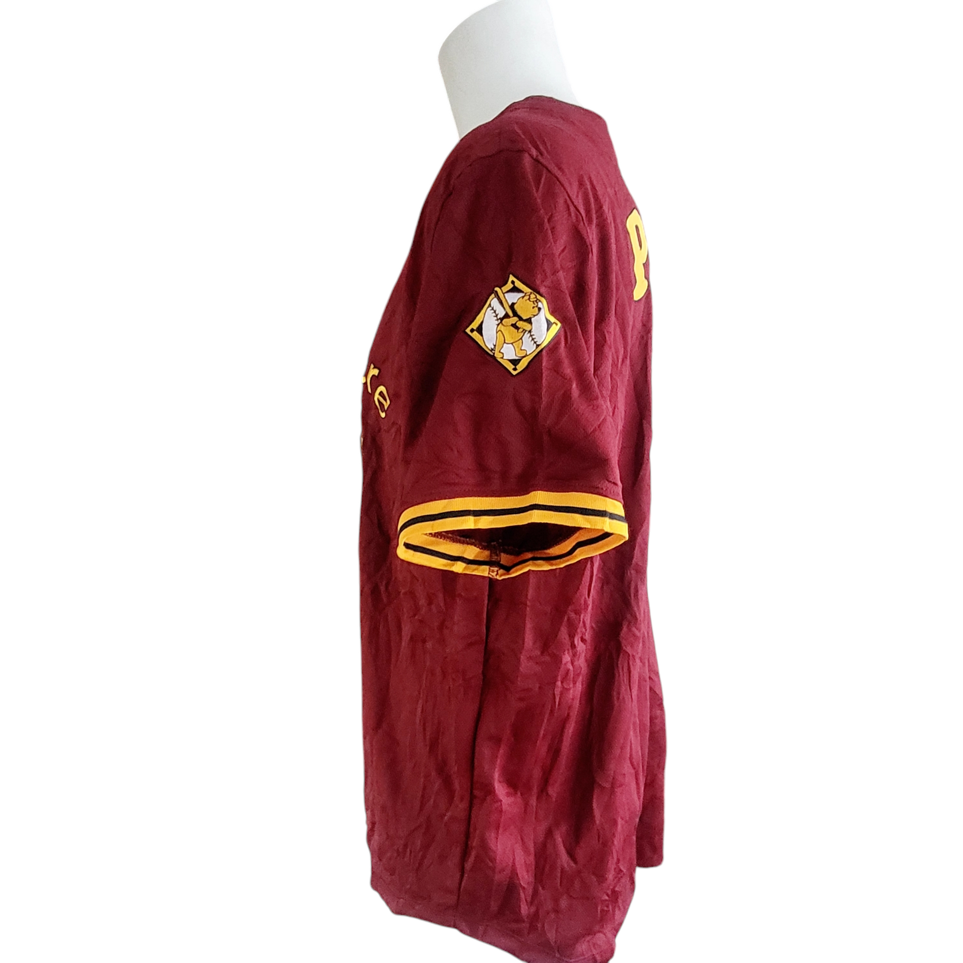 a man's maroon and yellow jacket on a white mannequin